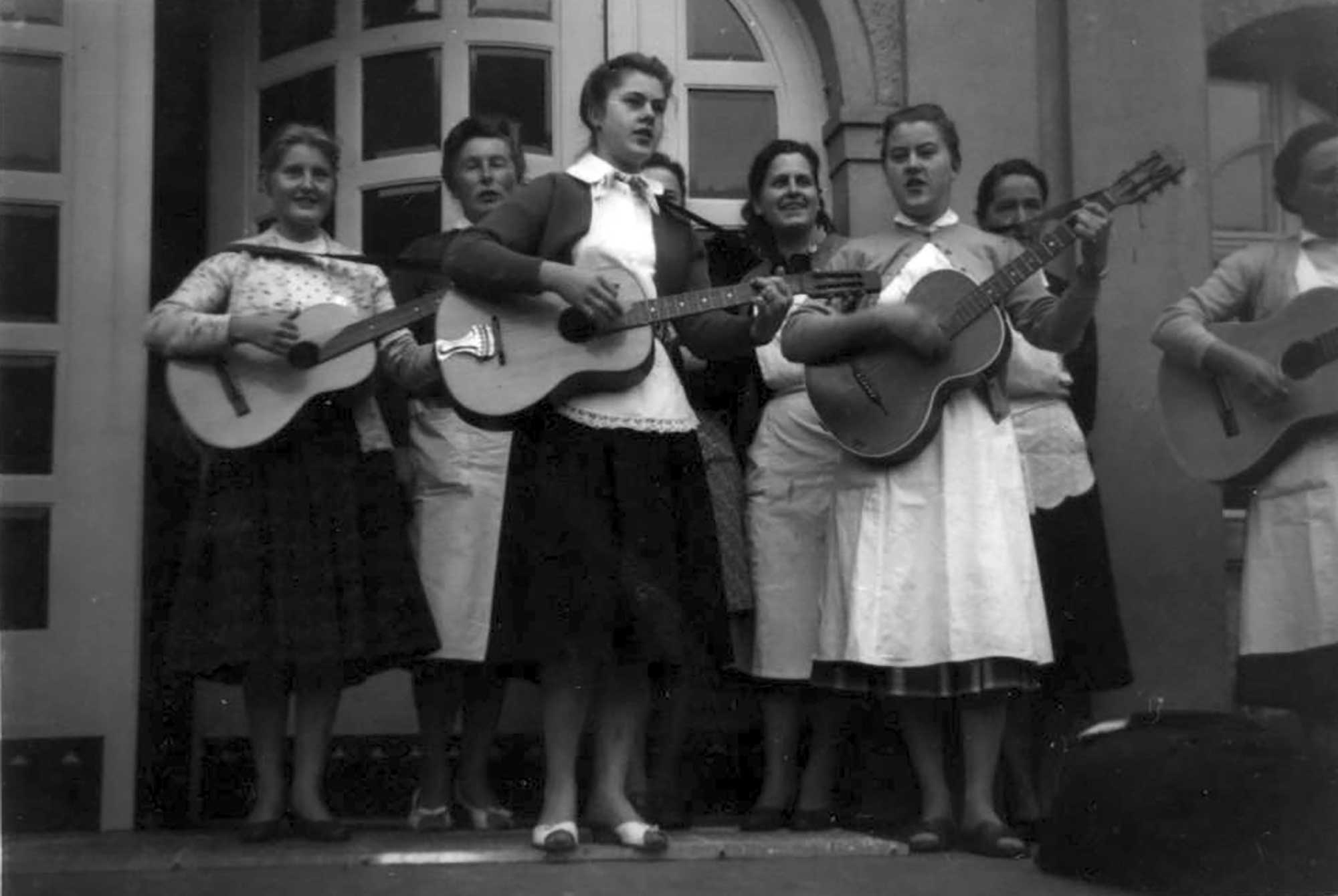 Staff playing their guitars