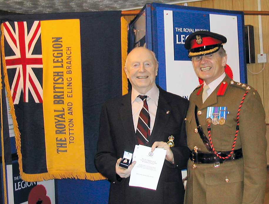 Bruce presented with his RAF veteran's badge